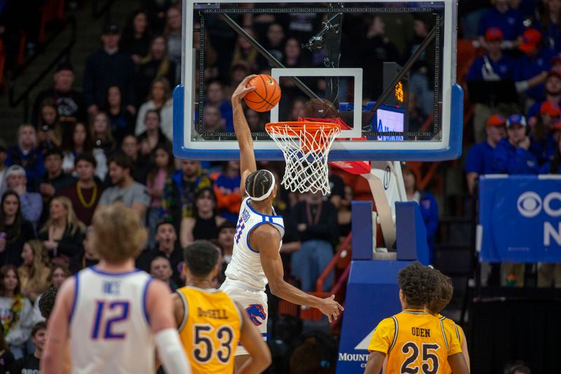 Feb 11, 2023; Boise, Idaho, USA; Boise State Broncos guard Chibuzo Agbo (11) dunks during the first half against the Wyoming Cowboys at ExtraMile Arena. Mandatory Credit: Brian Losness-USA TODAY Sports

