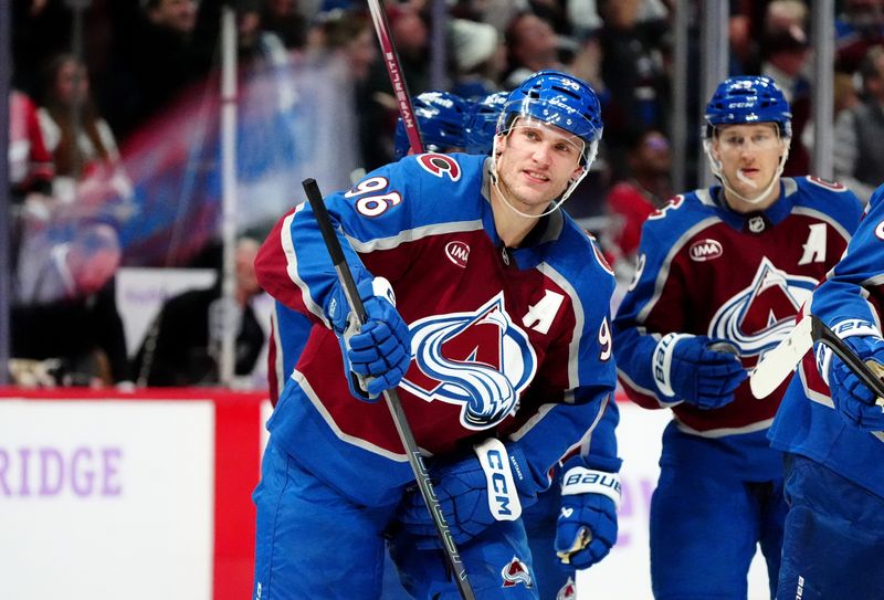 Nov 9, 2024; Denver, Colorado, USA; Colorado Avalanche right wing Mikko Rantanen (96) celebrates his open net goal in the third period against the Carolina Hurricanes at Ball Arena. Mandatory Credit: Ron Chenoy-Imagn Images