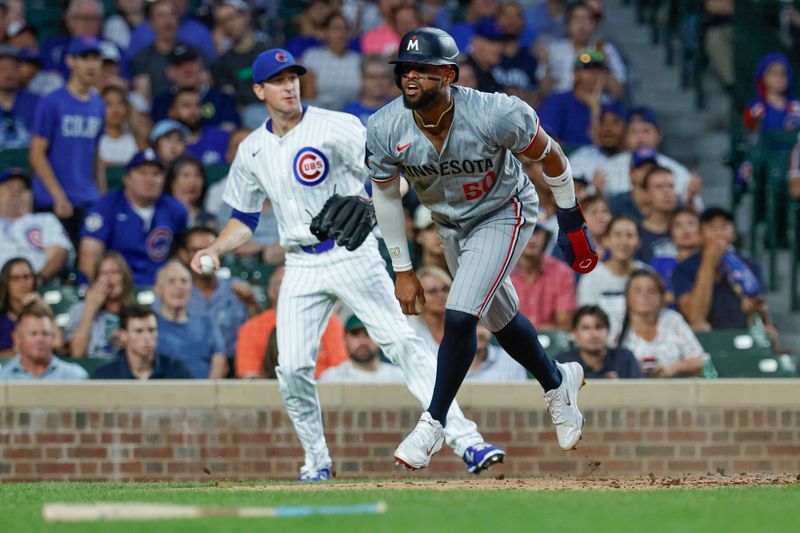 Aug 5, 2024; Chicago, Illinois, USA; Minnesota Twins second baseman Willi Castro (50) reacts after scoring against the Chicago Cubs during the third inning at Wrigley Field. Mandatory Credit: Kamil Krzaczynski-USA TODAY Sports