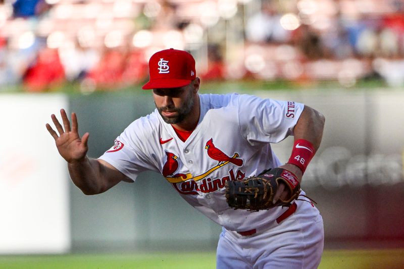 Jun 6, 2024; St. Louis, Missouri, USA;  St. Louis Cardinals first baseman Paul Goldschmidt (46) field a ground ball against the Colorado Rockies during the first inning at Busch Stadium. Mandatory Credit: Jeff Curry-USA TODAY Sports