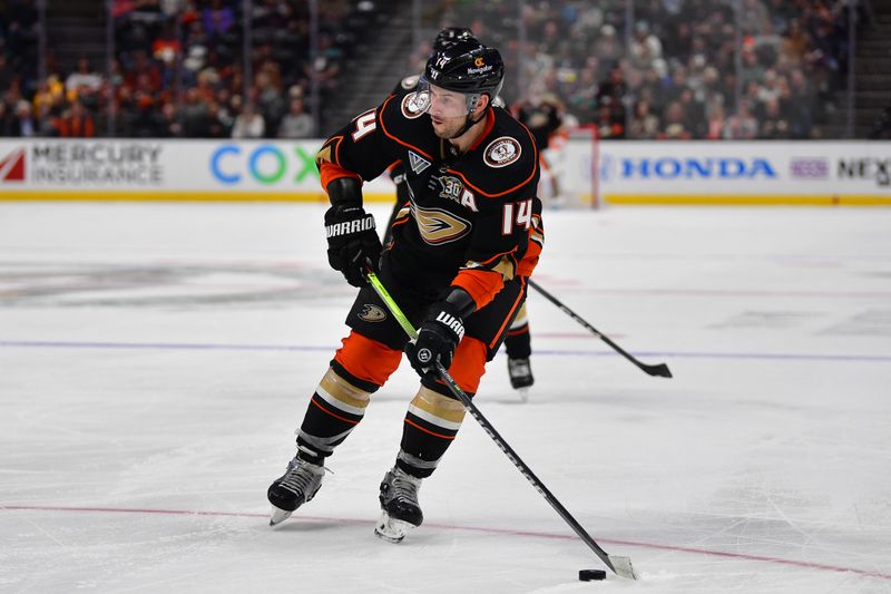 Feb 21, 2024; Anaheim, California, USA; Anaheim Ducks center Adam Henrique (14) controls the puck against the Columbus Blue Jackets during the third period at Honda Center. Mandatory Credit: Gary A. Vasquez-USA TODAY Sports