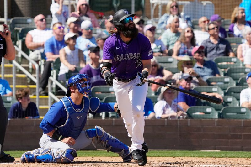 Mar 21, 2024; Salt River Pima-Maricopa, Arizona, USA; Colorado Rockies designated hitter Charlie Blackmon (19) hits a two run home run against the Chicago Cubs in the third inning at Salt River Fields at Talking Stick. Mandatory Credit: Rick Scuteri-USA TODAY Sports