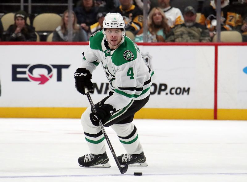 Nov 11, 2024; Pittsburgh, Pennsylvania, USA;  Dallas Stars defenseman Miro Heiskanen (4) moves the puck up ice against the Pittsburgh Penguins during the second period at PPG Paints Arena. Mandatory Credit: Charles LeClaire-Imagn Images