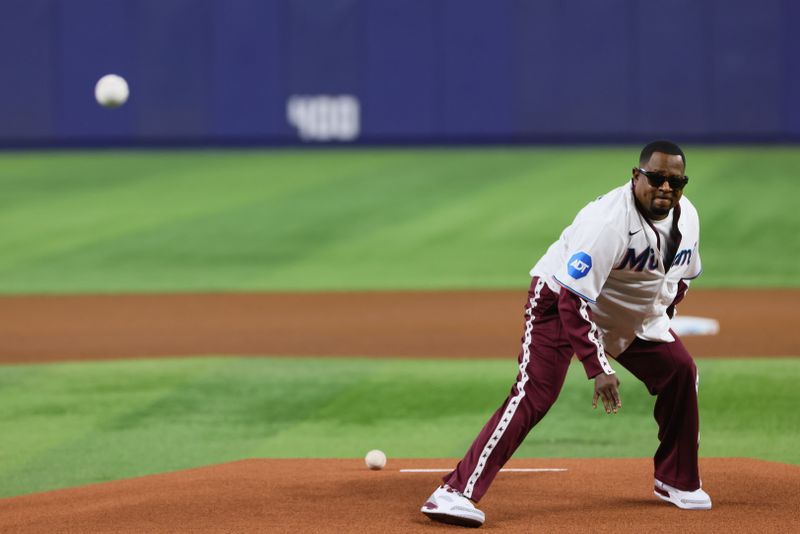 Jun 5, 2024; Miami, Florida, USA; Actor Martin Lawrence throws the ceremonial first pitch before the game between the Miami Marlins and the Tampa Bay Rays at loanDepot Park. Mandatory Credit: Sam Navarro-USA TODAY Sports