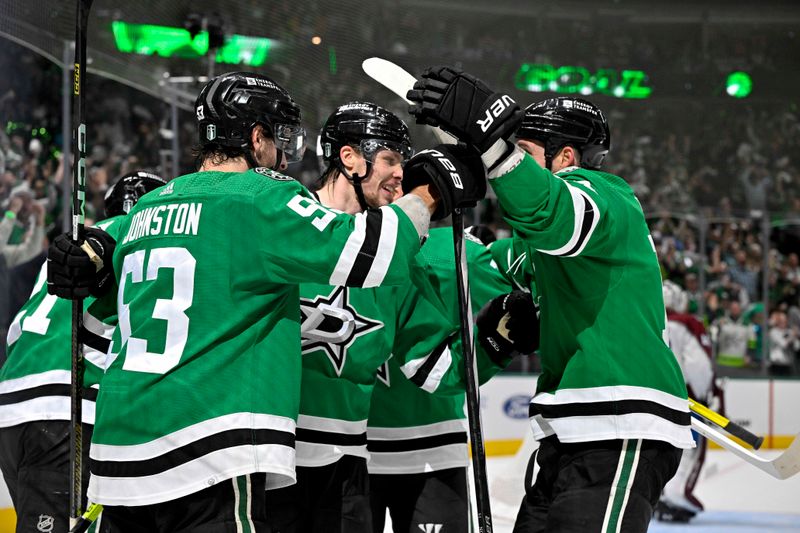 May 15, 2024; Dallas, Texas, USA; Dallas Stars defenseman Miro Heiskanen (4) and left wing Jason Robertson (21) and center Wyatt Johnston (53) and left wing Jamie Benn (14) celebrates a power play goal scored by Heiskanen against the Colorado Avalanche during the second period in game five of the second round of the 2024 Stanley Cup Playoffs at American Airlines Center. Mandatory Credit: Jerome Miron-USA TODAY Sports