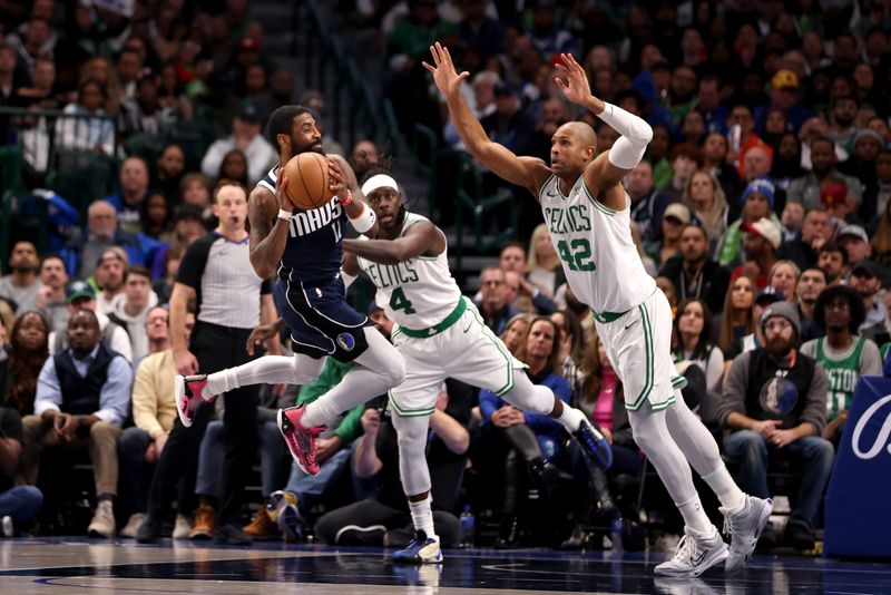 DALLAS, TEXAS - JANUARY 22: Kyrie Irving #11 of the Dallas Mavericks passes the ball against Jrue Holiday #4 and Al Horford #42 of the Boston Celtics in the second half at American Airlines Center on January 22, 2024 in Dallas, Texas. NOTE TO USER: User expressly acknowledges and agrees that, by downloading and or using this photograph, User is consenting to the terms and conditions of the Getty Images License Agreement. (Photo by Tim Heitman/Getty Images)