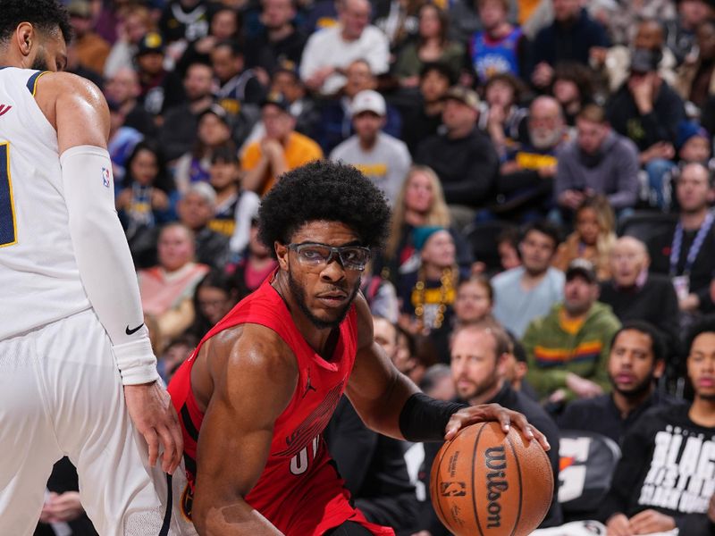 DENVER, CO - FEBRUARY 4: Scoot Henderson #00 of the Portland Trail Blazers dribbles the ball during the game against the Denver Nuggets on February 4, 2024 at the Ball Arena in Denver, Colorado. NOTE TO USER: User expressly acknowledges and agrees that, by downloading and/or using this Photograph, user is consenting to the terms and conditions of the Getty Images License Agreement. Mandatory Copyright Notice: Copyright 2024 NBAE (Photo by Bart Young/NBAE via Getty Images)