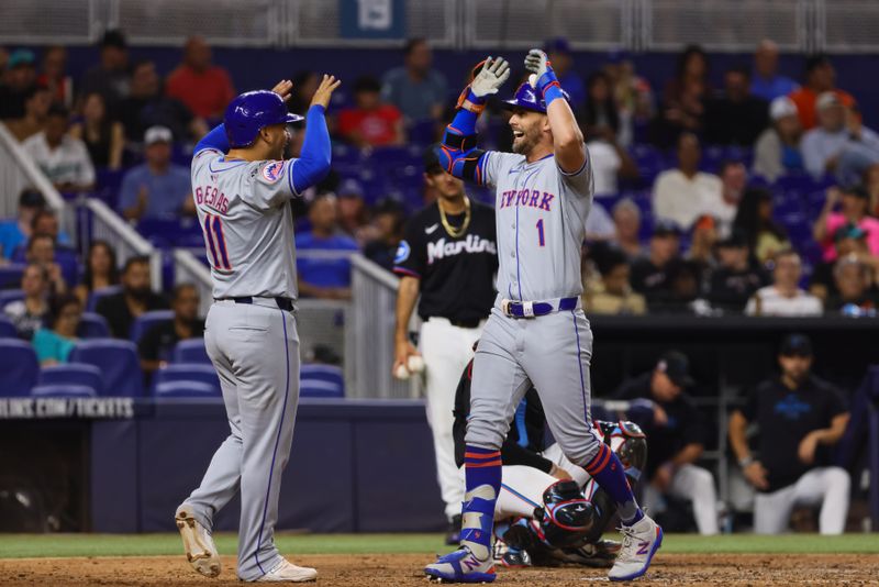 Jul 19, 2024; Miami, Florida, USA; New York Mets right fielder Jeff McNeil (1) celebrates with second baseman Jose Iglesias (11) after hitting a two-run home run against the Miami Marlins during the sixth inning at loanDepot Park. Mandatory Credit: Sam Navarro-USA TODAY Sports