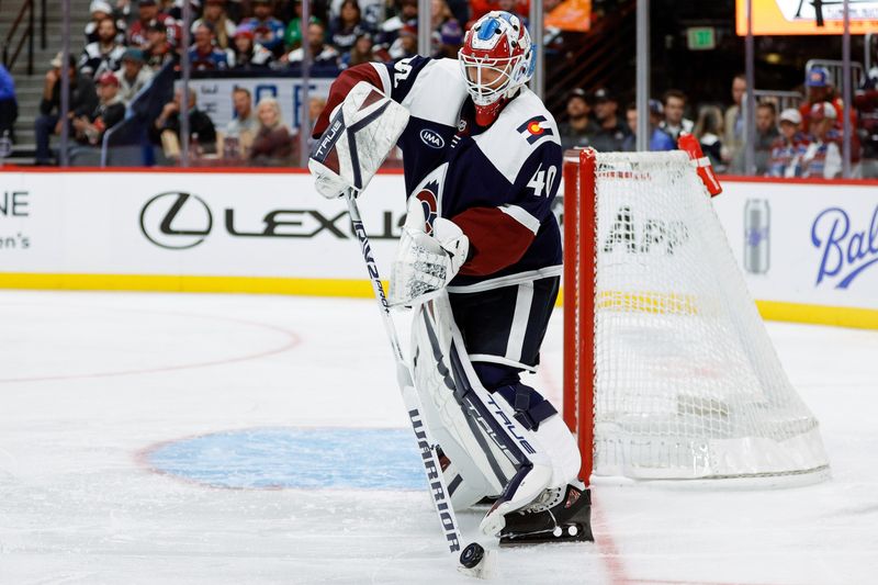 Oct 28, 2024; Denver, Colorado, USA; Colorado Avalanche goaltender Alexandar Georgiev (40) controls the puck in the third period against the Chicago Blackhawks at Ball Arena. Mandatory Credit: Isaiah J. Downing-Imagn Images