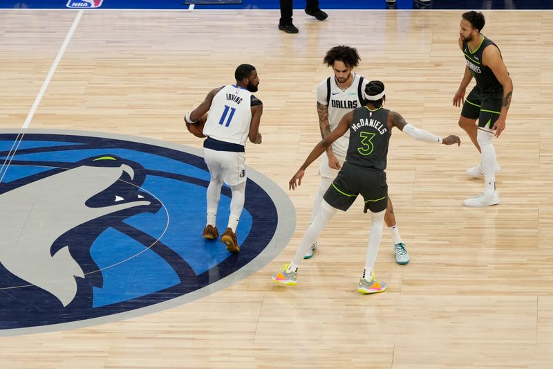 MINNEAPOLIS, MN - MAY 30: Kyrie Irving #11 of the Dallas Mavericks dribbles the ball during the game against the Minnesota Timberwolves during Game 5 of the Western Conference Finals of the 2024 NBA Playoffs on May 30, 2024 at Target Center in Minneapolis, Minnesota. NOTE TO USER: User expressly acknowledges and agrees that, by downloading and or using this Photograph, user is consenting to the terms and conditions of the Getty Images License Agreement. Mandatory Copyright Notice: Copyright 2024 NBAE (Photo by Jordan Johnson/NBAE via Getty Images)