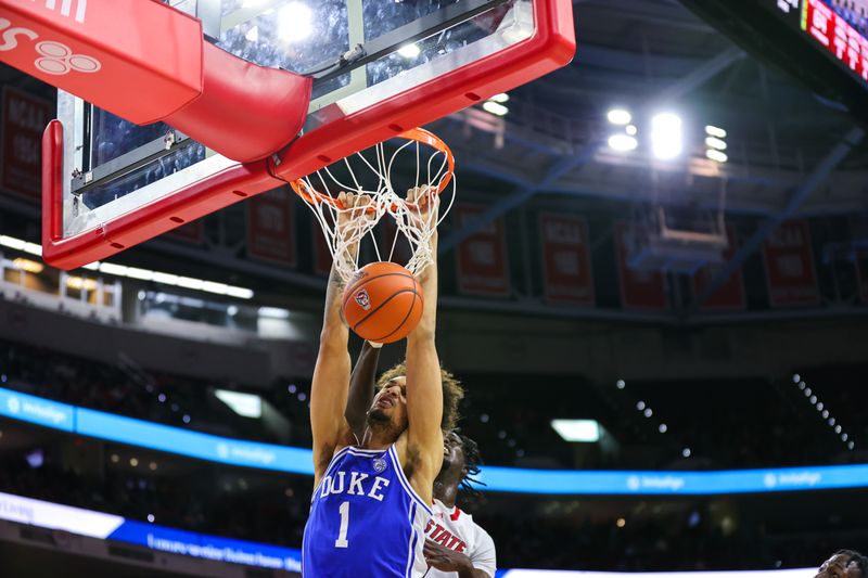 Jan 4, 2023; Raleigh, North Carolina, USA;  Duke Blue Devils center Dereck Lively II (1) dunks during the second half against North Carolina State Wolfpack at PNC Arena. Mandatory Credit: Jaylynn Nash-USA TODAY Sports