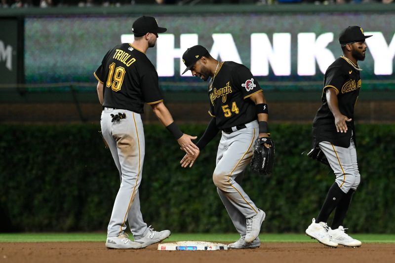 Sep 20, 2023; Chicago, Illinois, USA; Pittsburgh Pirates third baseman Jared Triolo (19) high fives Pittsburgh Pirates right fielder Joshua Palacios (54) after their game against the Chicago Cubs at Wrigley Field. Mandatory Credit: Matt Marton-USA TODAY Sports