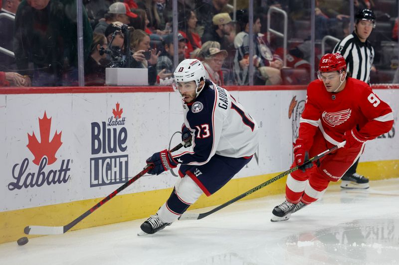 Nov 11, 2023; Detroit, Michigan, USA;  Columbus Blue Jackets left wing Johnny Gaudreau (13) skates with the puck against Detroit Red Wings right wing Alex DeBrincat (93) in the first period at Little Caesars Arena. Mandatory Credit: Rick Osentoski-USA TODAY Sports