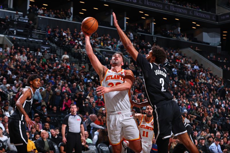 BROOKLYN, NY - MARCH 16: Georges Niang #20 of the Atlanta Hawks drives to the basket during the game against the Brooklyn Nets on March 16, 2025 at Barclays Center in Brooklyn, New York. NOTE TO USER: User expressly acknowledges and agrees that, by downloading and or using this Photograph, user is consenting to the terms and conditions of the Getty Images License Agreement. Mandatory Copyright Notice: Copyright 2025 NBAE (Photo by David L. Nemec/NBAE via Getty Images)