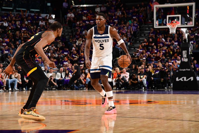 PHOENIX, AZ - APRIL  26: Anthony Edwards #5 of the Minnesota Timberwolves handles the ball during the game against the Phoenix Suns on April 26, 2024 at Footprint Center in Phoenix, Arizona. NOTE TO USER: User expressly acknowledges and agrees that, by downloading and or using this photograph, user is consenting to the terms and conditions of the Getty Images License Agreement. Mandatory Copyright Notice: Copyright 2024 NBAE (Photo by Kate Frese/NBAE via Getty Images)