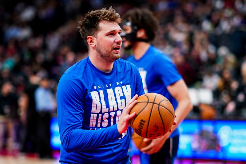TORONTO, CANADA - FEBRUARY 28: Luka Doncic #77 of the Dallas Mavericks warms up before the game against the Toronto Raptors on February 28, 2024 at the Scotiabank Arena in Toronto, Ontario, Canada.  NOTE TO USER: User expressly acknowledges and agrees that, by downloading and or using this Photograph, user is consenting to the terms and conditions of the Getty Images License Agreement.  Mandatory Copyright Notice: Copyright 2024 NBAE (Photo by Mark Blinch/NBAE via Getty Images)