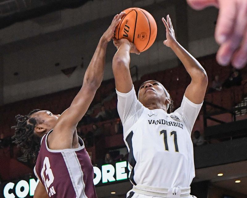 Mar 1, 2023; Greenville, SC, USA; Vanderbilt guard Ciaja Harbison (11) has her shot blocked by Texas A&M guard McKinzie Green (23) during the third quarter of the SEC Women's Basketball Tournament at Bon Secours Wellness Arena. Mandatory Credit: Ken Ruinard-USA TODAY Sports