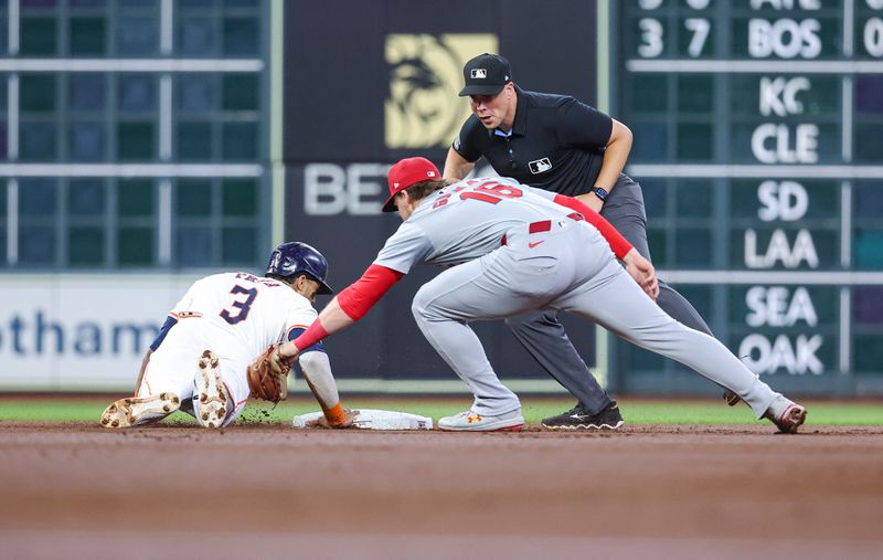 Jun 5, 2024; Houston, Texas, USA; Houston Astros shortstop Jeremy Pena (3) is safe at second base as St. Louis Cardinals second baseman Nolan Gorman (16) attempts to apply a tag on a play during the first inning at Minute Maid Park. Mandatory Credit: Troy Taormina-USA TODAY Sports