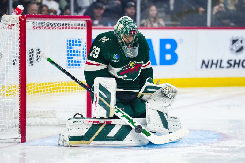 Jan 2, 2024; Saint Paul, Minnesota, USA; Minnesota Wild goaltender Marc-Andre Fleury (29) makes a save during the first period against the Calgary Flames at Xcel Energy Center. Mandatory Credit: Brace Hemmelgarn-USA TODAY Sports