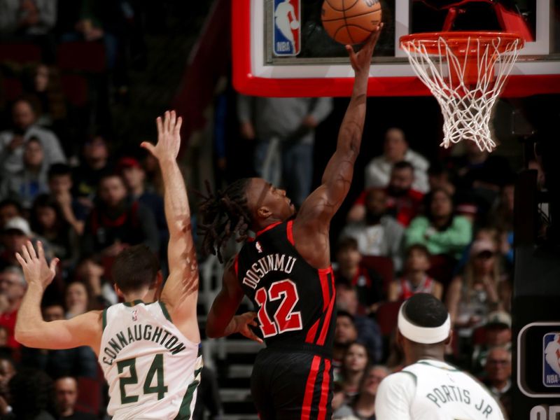 CHICAGO, IL - MARCH 1: Ayo Dosunmu #12 of the Chicago Bulls shoots the ball during the game against the Milwaukee Bucks on March 1, 2024 at United Center in Chicago, Illinois. NOTE TO USER: User expressly acknowledges and agrees that, by downloading and or using this photograph, User is consenting to the terms and conditions of the Getty Images License Agreement. Mandatory Copyright Notice: Copyright 2024 NBAE (Photo by Gary Dineen/NBAE via Getty Images)