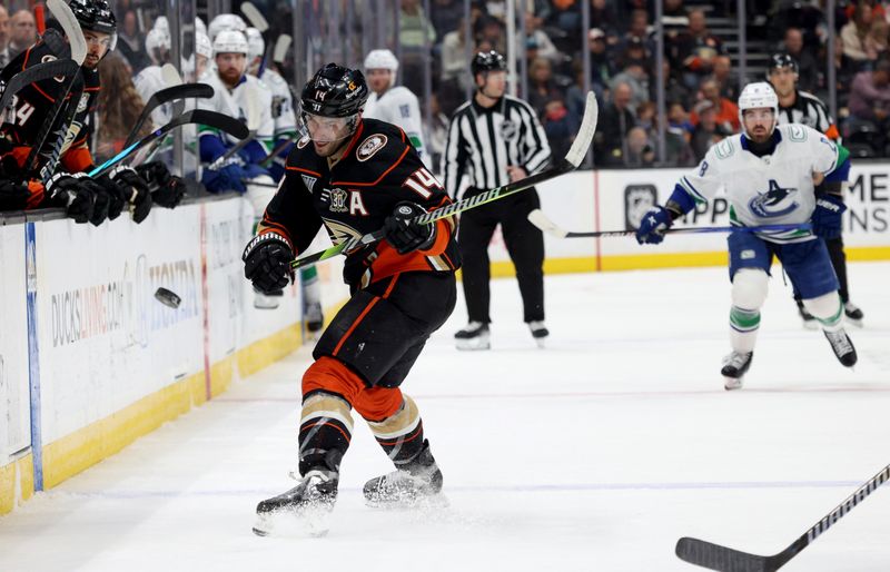 Mar 3, 2024; Anaheim, California, USA; Anaheim Ducks center Adam Henrique (14) passes during the second period against the Vancouver Canucks at Honda Center. Mandatory Credit: Jason Parkhurst-USA TODAY Sports