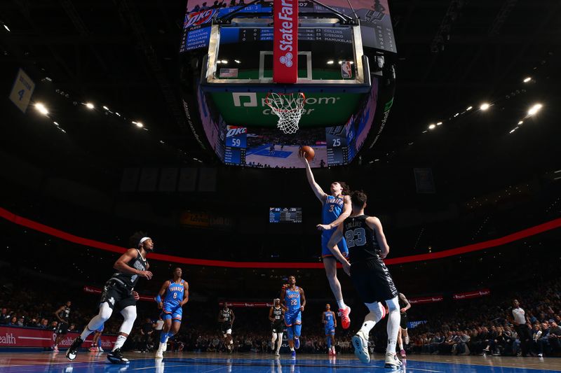 OKLAHOMA CITY, OK - APRIL 10:  Josh Giddey #3 of the Oklahoma City Thunder drives to the basket during the game against the San Antonio Spurs on April 10, 2024 at Paycom Arena in Oklahoma City, Oklahoma. NOTE TO USER: User expressly acknowledges and agrees that, by downloading and or using this photograph, User is consenting to the terms and conditions of the Getty Images License Agreement. Mandatory Copyright Notice: Copyright 2024 NBAE (Photo by Zach Beeker/NBAE via Getty Images)