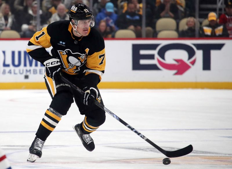 Nov 2, 2024; Pittsburgh, Pennsylvania, USA;  Pittsburgh Penguins center Evgeni Malkin (71) skates up ice with the puck against the Montreal Canadiens during the first period at PPG Paints Arena. Mandatory Credit: Charles LeClaire-Imagn Images