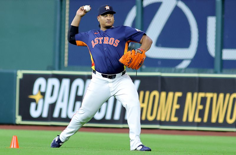 May 28, 2025; Houston, Texas, USA; Houston Astros pitcher Luis Garcia (77) works out prior to the game against the Athletics at Daikin Park. Mandatory Credit: Erik Williams-Imagn Images