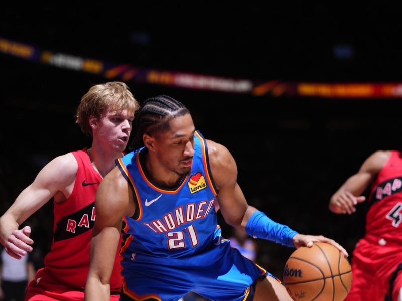 TORONTO, CANADA - DECEMBER 05: Aaron Wiggins #21 of the Oklahoma City Thunder handles the ball during the game against the Toronto Raptors on December 05, 2024 at the Scotiabank Arena in Toronto, Ontario, Canada.  NOTE TO USER: User expressly acknowledges and agrees that, by downloading and or using this Photograph, user is consenting to the terms and conditions of the Getty Images License Agreement.  Mandatory Copyright Notice: Copyright 2024 NBAE (Photo by Mark Blinch/NBAE via Getty Images)