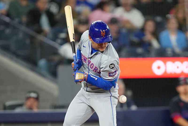 Sep 9, 2024; Toronto, Ontario, CAN; New York Mets first baseman Pete Alonso (20) is hit by a pitch from Toronto Blue Jays pitcher Ryan Yarbrough (not pictured) during the fourth inning at Rogers Centre. Mandatory Credit: John E. Sokolowski-Imagn Images