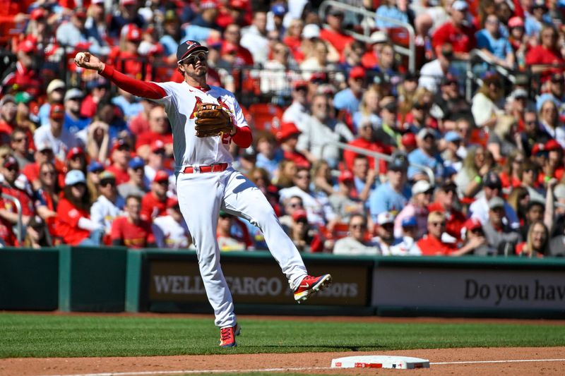 Apr 2, 2023; St. Louis, Missouri, USA;  St. Louis Cardinals third baseman Nolan Arenado (28) throws on the run against the Toronto Blue Jays during the sixth inning at Busch Stadium. Mandatory Credit: Jeff Curry-USA TODAY Sports