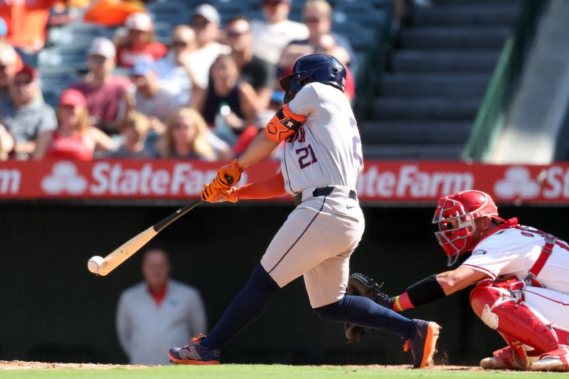 Sep 15, 2024; Anaheim, California, USA;  Houston Astros second baseman Jose Altuve (21) grounds into a double-play during the eighth inning against the Los Angeles Angels at Angel Stadium. Mandatory Credit: Kiyoshi Mio-Imagn Images