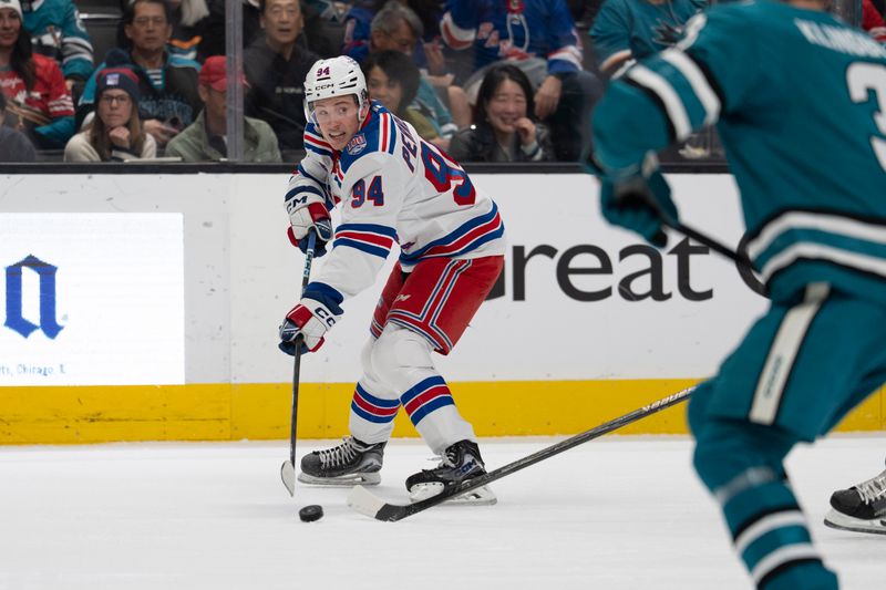 Jan 23, 2026; San Jose, California, USA;  New York Rangers right wing Gabe Perreault (94) looks to pass the puck during the first period against the San Jose Sharks at SAP Center at San Jose. Mandatory Credit: Stan Szeto-Imagn Images