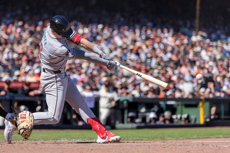 Apr 21, 2024; San Francisco, California, USA;  Arizona Diamondbacks shortstop Kevin Newman (18) hits an RBI double against the San Francisco Giants during the ninth inning at Oracle Park. Mandatory Credit: John Hefti-USA TODAY Sports