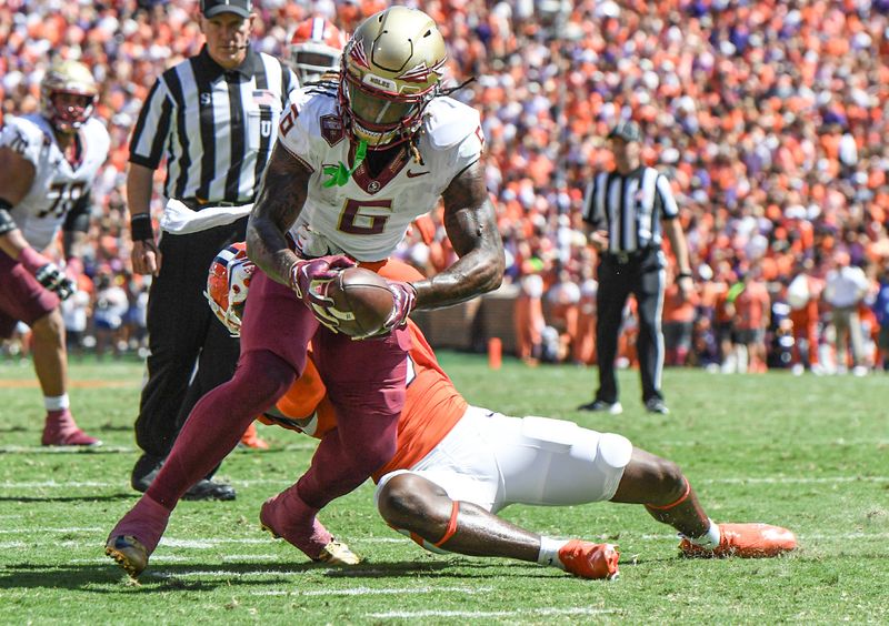 Sep 23, 2023; Clemson, South Carolina, USA; Florida State Seminoles tight end Jaheim Bell (6) is tackled short of the end zone by Clemson Tigers safety Andrew Mukuba (1) during the second quarter at Memorial Stadium. Mandatory Credit: Ken Ruinard-USA TODAY Sports