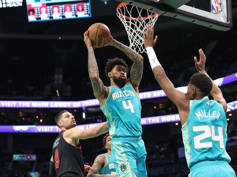 CHARLOTTE, NC - JANUARY 31: Nick Richards #4 of the Charlotte Hornets grabs a rebound during the game against the Chicago Bulls on January 31, 2024 at Spectrum Center in Charlotte, North Carolina. NOTE TO USER: User expressly acknowledges and agrees that, by downloading and or using this photograph, User is consenting to the terms and conditions of the Getty Images License Agreement.  Mandatory Copyright Notice:  Copyright 2024 NBAE (Photo by Brock Williams-Smith/NBAE via Getty Images)