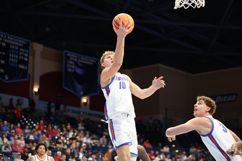 Nov 27, 2025; San Diego, California, USA; Florida Gators forward Thomas Haugh (10) shoots a layup against the Texas Christian University Horned Frogs during the second half at Jenny Craig Pavilion. Mandatory Credit: Abe Arredondo-Imagn Images