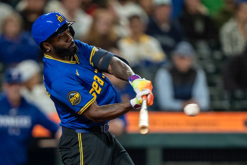 Sep 13, 2024; Seattle, Washington, USA;  Seattle Mariners left fielder Randy Arozarena (56) hits a RBI-single during the seventh inning against the Texas Rangers at T-Mobile Park. Mandatory Credit: Stephen Brashear-Imagn Images