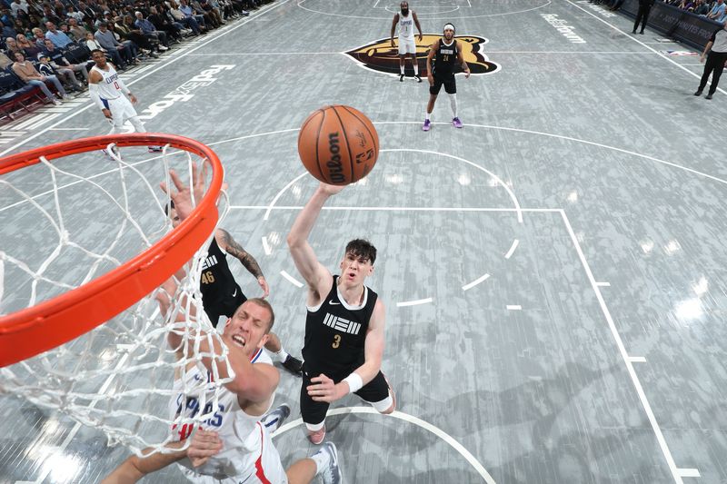 MEMPHIS, TN - FEBRUARY 23: Jake LaRavia #3 of the Memphis Grizzlies rebounds the ball during the game against the LA Clippers on February 23, 2024 at FedExForum in Memphis, Tennessee. NOTE TO USER: User expressly acknowledges and agrees that, by downloading and or using this photograph, User is consenting to the terms and conditions of the Getty Images License Agreement. Mandatory Copyright Notice: Copyright 2024 NBAE (Photo by Joe Murphy/NBAE via Getty Images)