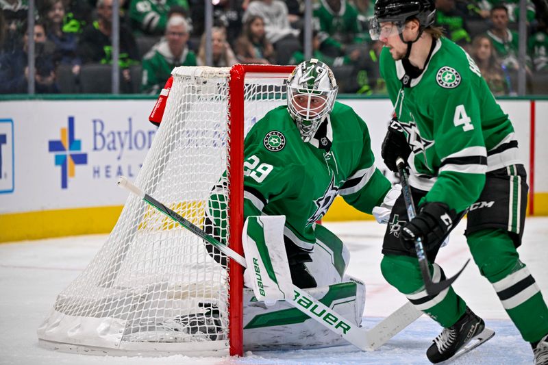 Dec 1, 2024; Dallas, Texas, USA; Dallas Stars goaltender Jake Oettinger (29) and defenseman Miro Heiskanen (4) faces the Winnipeg Jets attack during the third period at the American Airlines Center. Mandatory Credit: Jerome Miron-Imagn Images