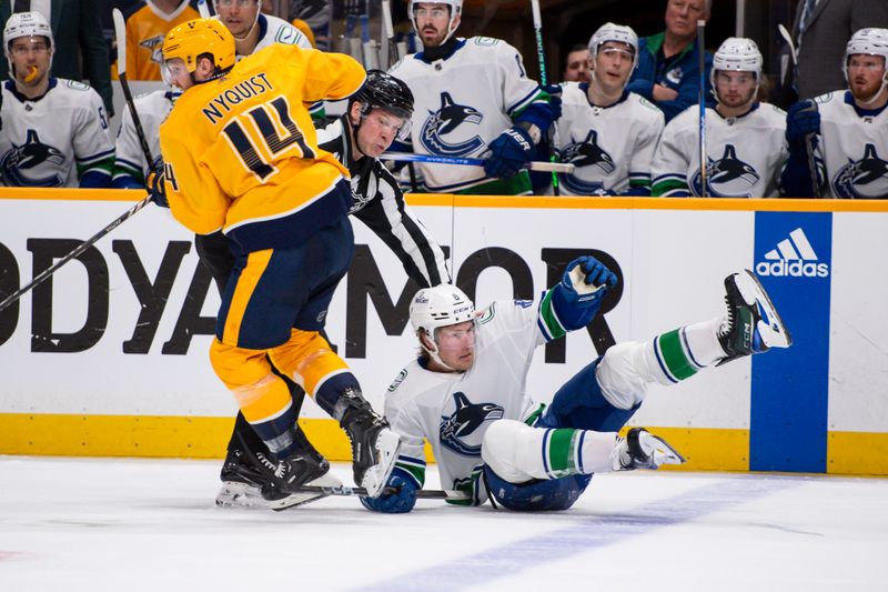 Apr 26, 2024; Nashville, Tennessee, USA; Nashville Predators center Gustav Nyquist (14) takes down Vancouver Canucks right wing Conor Garland (8) during the second period in game three of the first round of the 2024 Stanley Cup Playoffs at Bridgestone Arena. Mandatory Credit: Steve Roberts-USA TODAY Sports