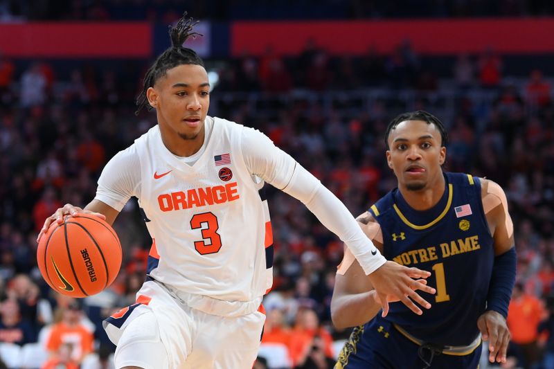 Jan 14, 2023; Syracuse, New York, USA; Syracuse Orange guard Judah Mintz (3) drives to the basket past Notre Dame Fighting Irish guard J.J. Starling (1) during the first half at the JMA Wireless Dome. Mandatory Credit: Rich Barnes-USA TODAY Sports