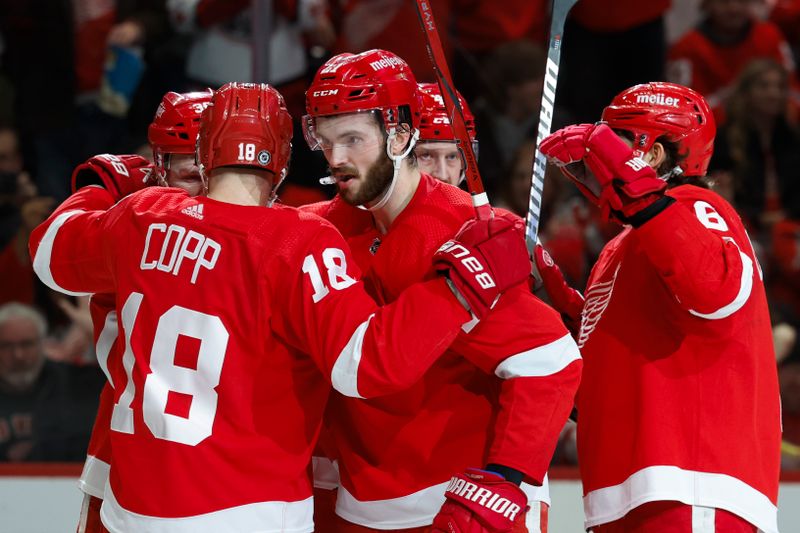 Jan 13, 2024; Detroit, Michigan, USA;  Detroit Red Wings center Andrew Copp (18) receives congratulations from teammates after scoring in the second period against the Los Angeles Kings at Little Caesars Arena. Mandatory Credit: Rick Osentoski-USA TODAY Sports