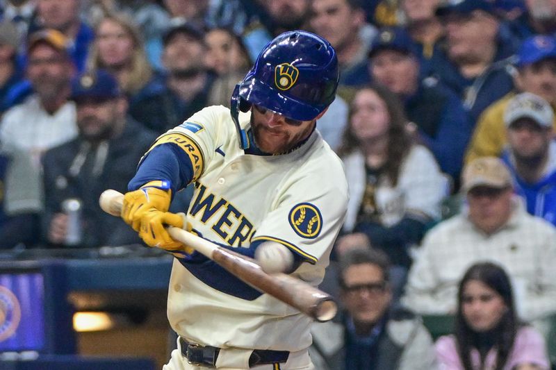 Apr 2, 2024; Milwaukee, Wisconsin, USA;  Milwaukee Brewers second baseman Brice Turang (2) hits a double to drive in a run in the third inning against the Minnesota Twins at American Family Field. Mandatory Credit: Benny Sieu-USA TODAY Sports