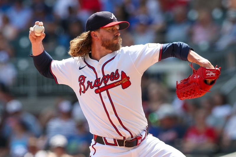 Jul 7, 2024; Atlanta, Georgia, USA; Atlanta Braves pitcher Pierce Johnson (38) throws against the Philadelphia Phillies in the eighth inning at Truist Park. Mandatory Credit: Brett Davis-USA TODAY Sports
