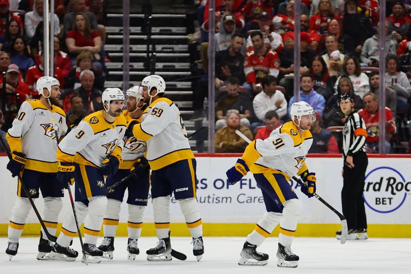 Nov 7, 2024; Sunrise, Florida, USA; Nashville Predators center Steven Stamkos (91) celebrates with teammates after scoring against the Florida Panthers during the second period at Amerant Bank Arena. Mandatory Credit: Sam Navarro-Imagn Images