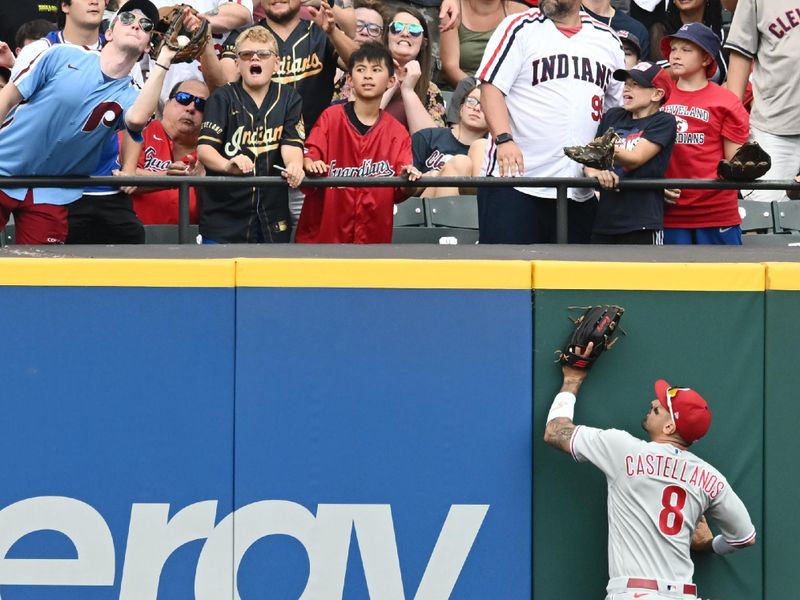 Jul 23, 2023; Cleveland, Ohio, USA; Philadelphia Phillies right fielder Nick Castellanos (8) watches as a fan catches a home run hit by Cleveland Guardians second baseman Andres Gimenez (not pictured) during the second inning at Progressive Field. Mandatory Credit: Ken Blaze-USA TODAY Sports