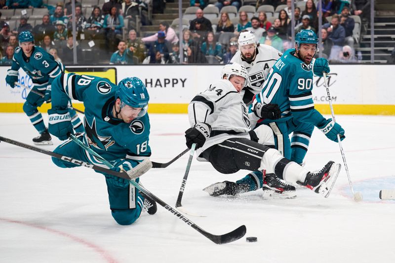 Apr 4, 2024; San Jose, California, USA; San Jose Sharks right wing Filip Zadina (18) shoots the puck against Los Angeles Kings defenseman Mikey Anderson (44) during the second period at SAP Center at San Jose. Mandatory Credit: Robert Edwards-USA TODAY Sports