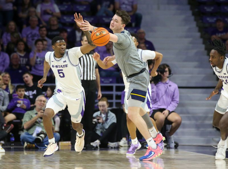 Feb 26, 2024; Manhattan, Kansas, USA; Kansas State Wildcats guard Cam Carter (5) and West Virginia Mountaineers forward Quinn Slazinski (11) go after a loose ball during the first half at Bramlage Coliseum. Mandatory Credit: Scott Sewell-USA TODAY Sports