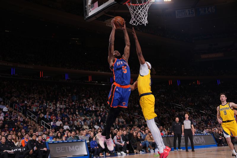 NEW YORK, NY - FEBRUARY 10: Precious Achiuwa #5 of the New York Knicks drives to the basket during the game against the Indiana Pacers on February 10, 2024 at Madison Square Garden in New York City, New York.  NOTE TO USER: User expressly acknowledges and agrees that, by downloading and or using this photograph, User is consenting to the terms and conditions of the Getty Images License Agreement. Mandatory Copyright Notice: Copyright 2024 NBAE  (Photo by Jesse D. Garrabrant/NBAE via Getty Images)